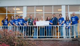 GSU President Mark Manchin, representatives from Pioneer Shooting Club, and members of First Baptist Church gather for a photo with the donation to the church's Cancer Fund