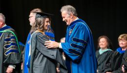 Fall 2024 MBA Graduate Hannah DeMarino and GSU Mark A. Manchin at GSU Fall Hooding Ceremony