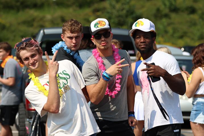 Three students giving a peace sign