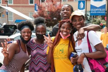 Several students posing and smiling at the camera