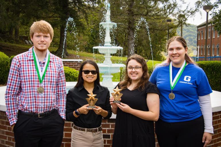 GSU Debate Team holding trophies from the 2023 Season