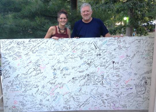 Dr. Megan Darby being presented the Bean Blossom Wall of Fame at the 45th Annual Bill Monroe Memorial Bluegrass Festival in 2012