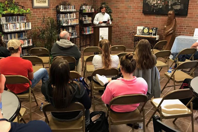 Dr. Jonathan Minton reads from his book of poetry at a previous Celebration of Words event