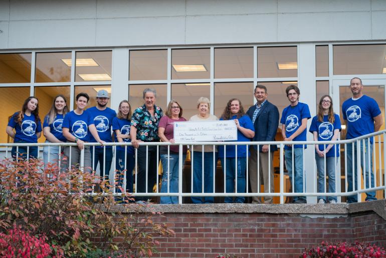 GSU President Mark Manchin, representatives from Pioneer Shooting Club, and members of First Baptist Church gather for a photo with the donation to the church's Cancer Fund