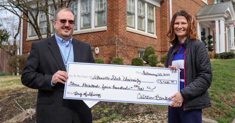 Chris Arden, Chief Financial Officer and Senior Vice President at Calhoun Banks, joins Glenville State University’s Director of Fundraising Vada Woodford for a check presentation. Calhoun Banks was among the 800+ donors who contributed to Glenville State’s annual Founders Day of Giving. (GSU Photo/Dustin Crutchfield)