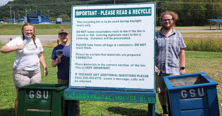 Glenville State University students (l-r) Veronica Rowse, Jared Bishop, and Seth Price with the recently repainted flowerboxes. The students are part of Glenville State’s Environmental Science Club. (Courtesy photo)