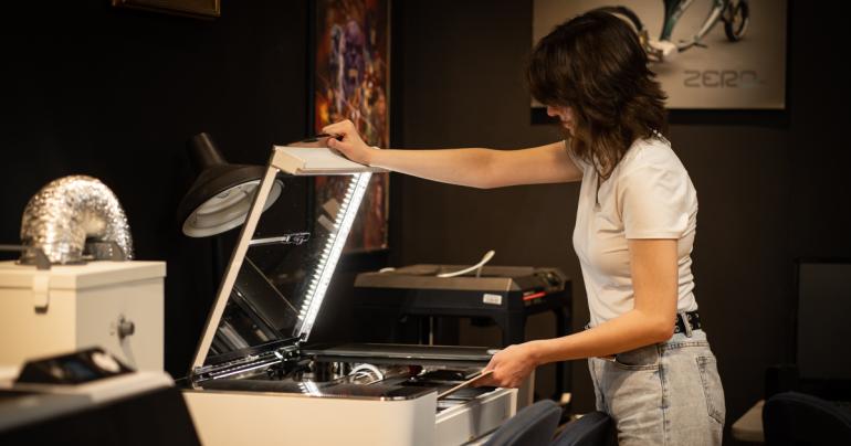 Glenville State University art and design student Mary Bever uses the GlowForge. (GSU Photo/Kristen Cosner)