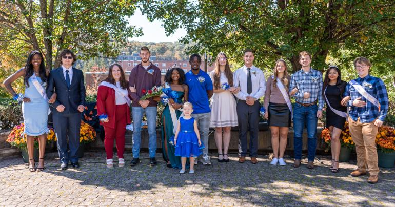 The 2022 Glenville State University Homecoming Court (l-r) Sophomore Princess Adria Chapple, Escort Garrett Watts, Senior Princess Abby Taylor, Escort Noah Schultz, Queen Jordyn Dansby-Ross, Court Attendant Lori Yeager, Escort Dane Lynch, Senior Princess Mary Pratt, Escort Pierre Venter, Junior Princess Kim Halsey, Escort John Kolodzieg, Freshman Princess Mimi Carr, and Freshman Prince Chris Goff. (GSU Photo/Kristen Cosner)