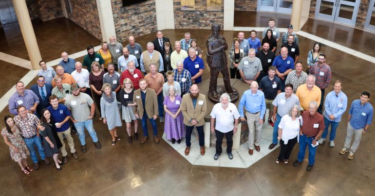 Alumni of the Land Surveying Program at Glenville State University join faculty, staff, current students, and other guests for a group photo during the 50th anniversary celebration of the program that was held on September 10. (GSU Photo/Dustin Crutchfield)