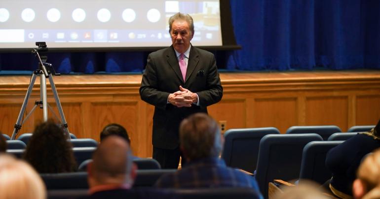 Glenville State College President Dr. Mark A. Manchin speaks to faculty and staff assembled for the annual opening meeting. The meeting is held prior the beginning of each semester and serves as an opportunity for employees to hear campus updates. (GSC Photo/Kristen Cosner)