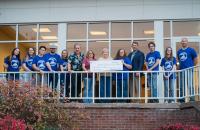 GSU President Mark Manchin, representatives from Pioneer Shooting Club, and members of First Baptist Church gather for a photo with the donation to the church's Cancer Fund